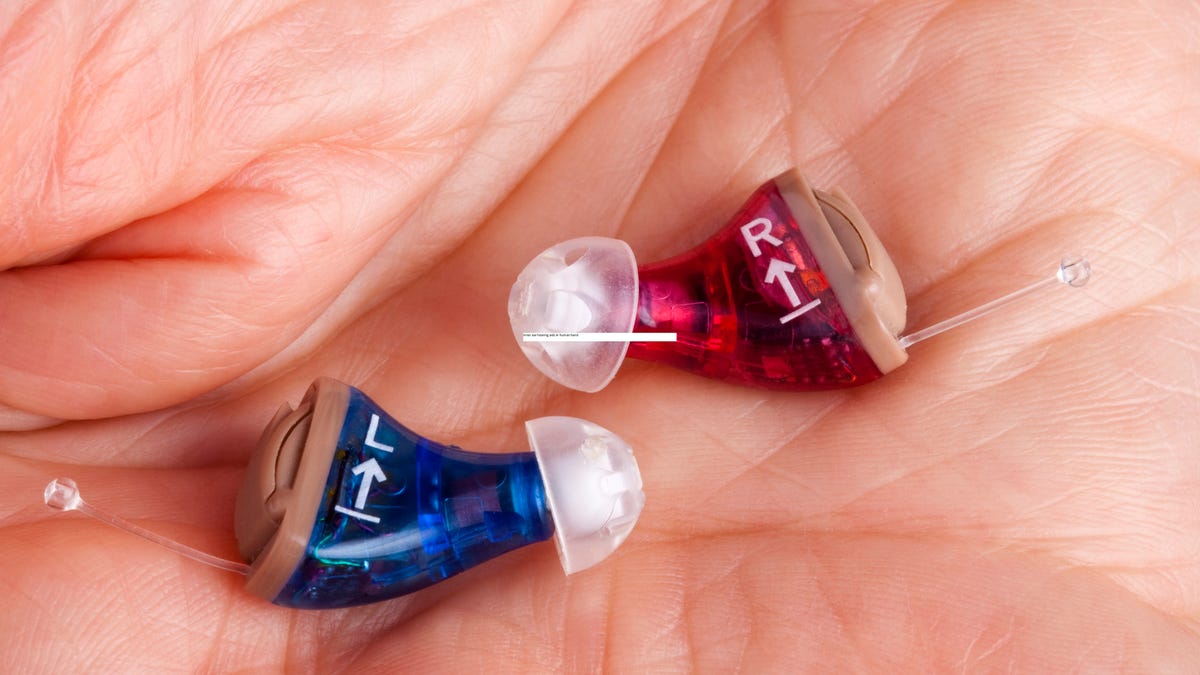 Hearing aids in a hand