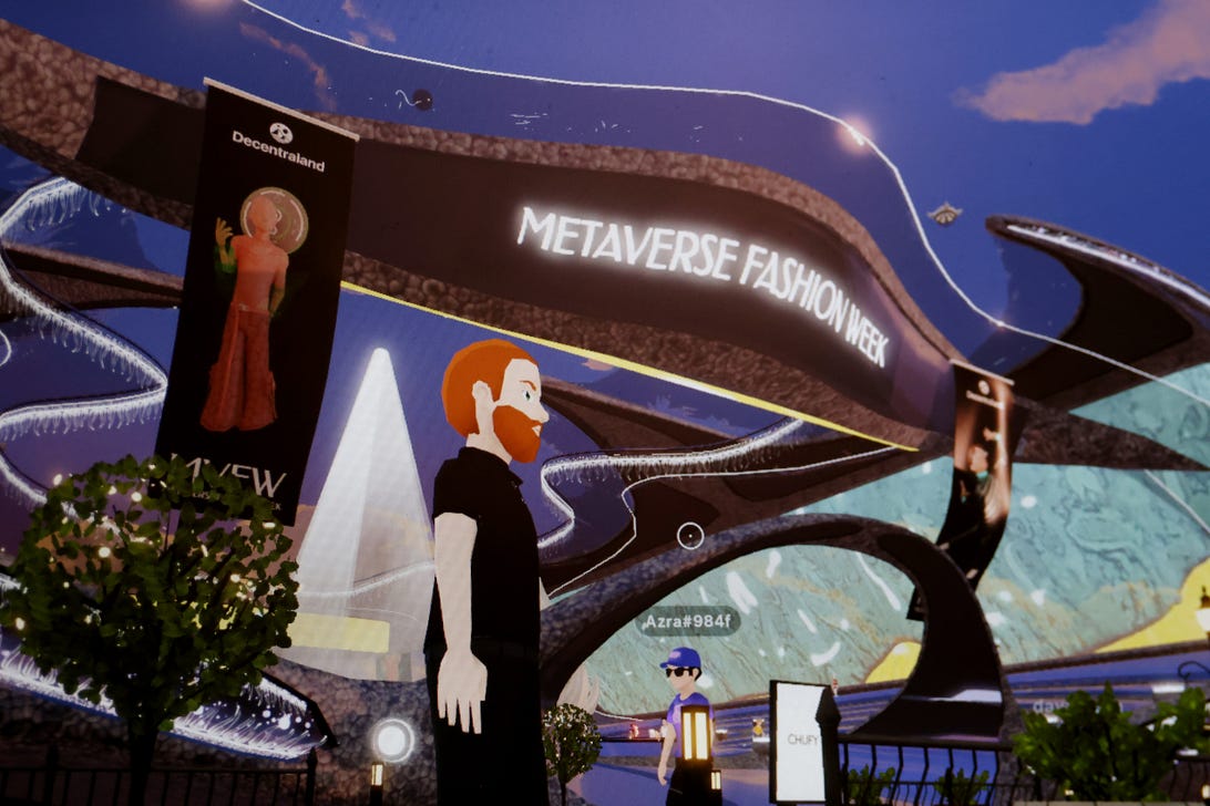 A bearded avatar in the digital Decentraland under a sign that reads 