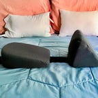 S.O.S. Side Sleeper Pregnancy Wedge Pillow on a bed