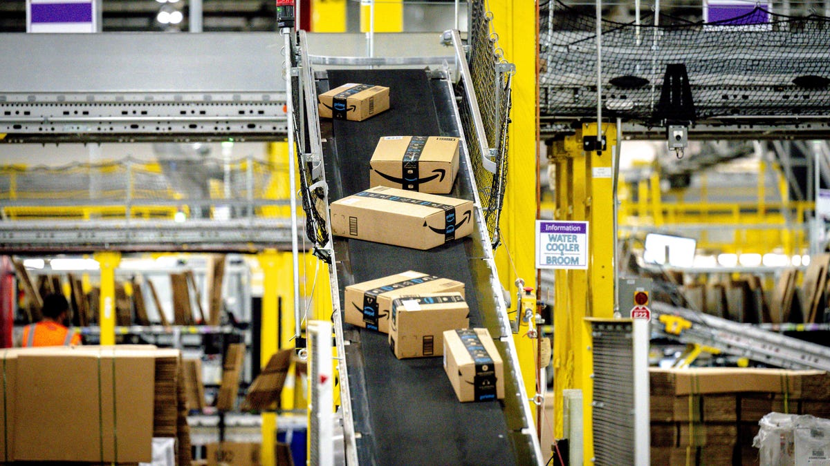Packages move along a conveyor at Amazon fulfillment center