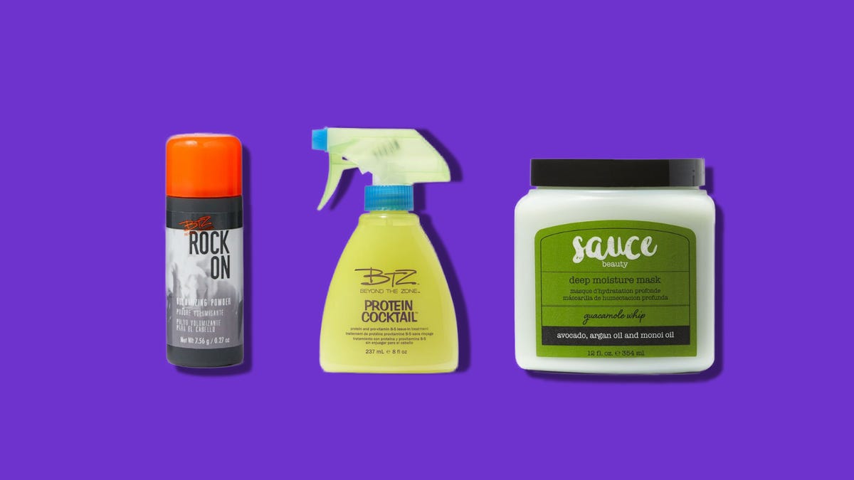 Three hair care products side by side on a purple background
