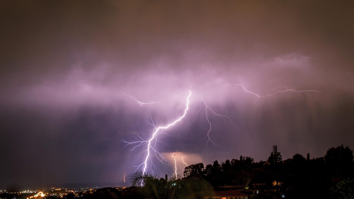 Lightning above a city at night.