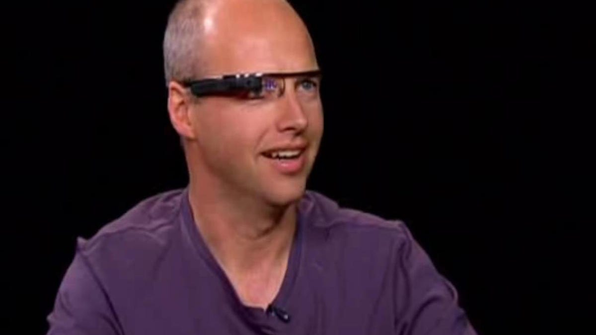 Sebastian Thrun of Google X operate's Google's wearable computer glasses during an interview with Charlie Rose.