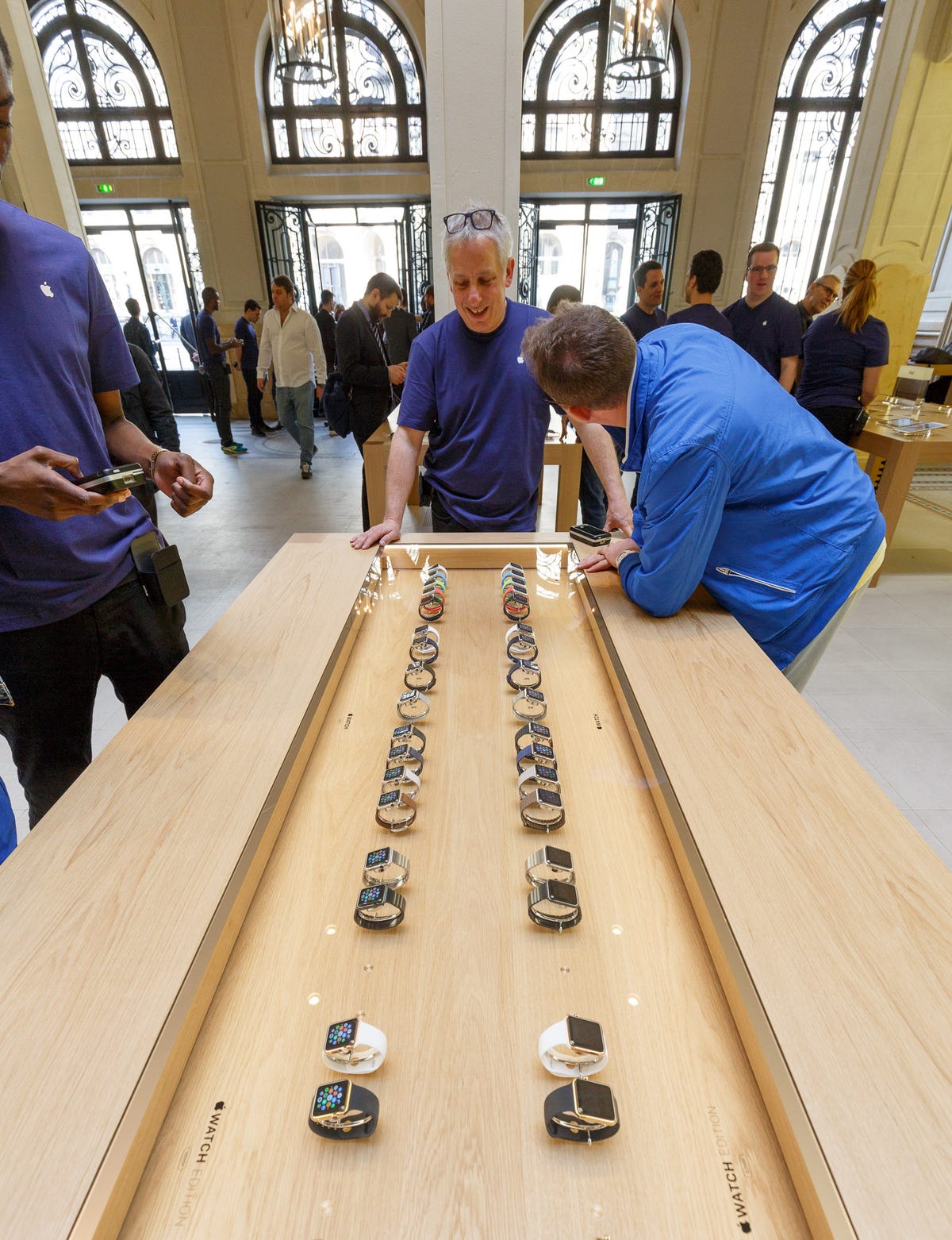​A visitor looks at Apple Watch models at a Paris Apple store.