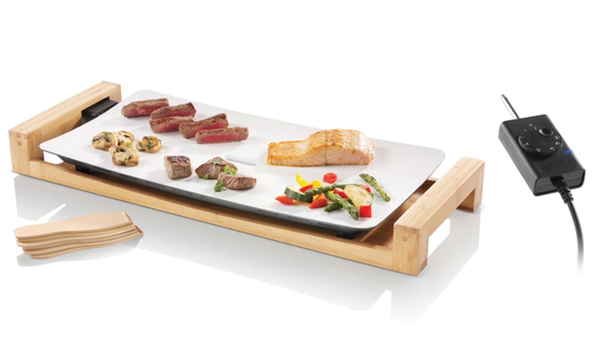 The Swissmar Fusion Table Grill lets eaters cook their own food.