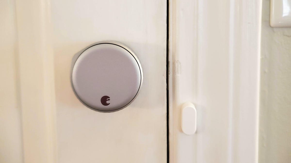 Close up of a door with an August Wi-Fi smart lock. 