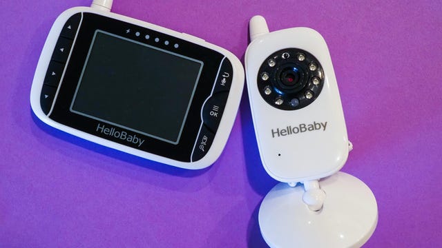 A HelloBaby monitor against a bright purple background 