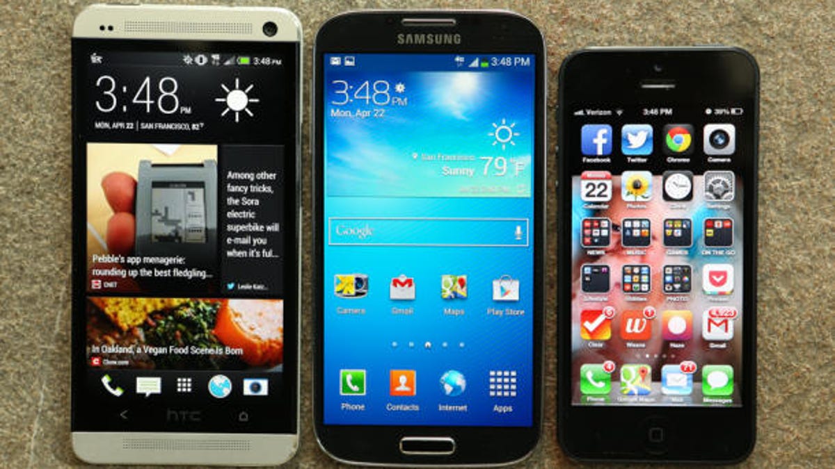 HTC's One, left, alongside the Galaxy S4 and iPhone 5.