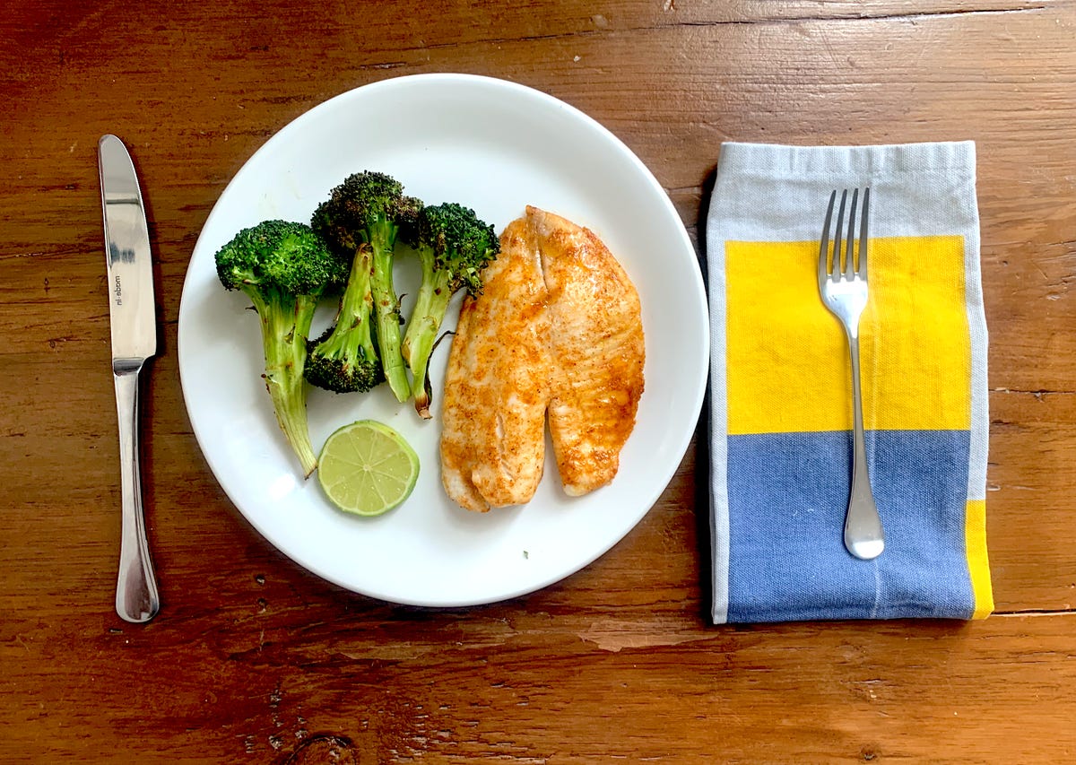 fish and broccoli on plate