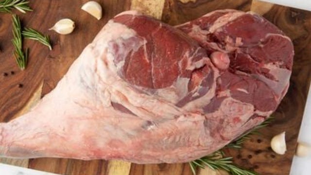 leg of lamb on cutting board