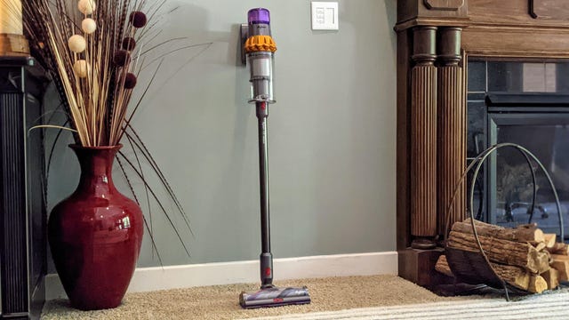 Dyson V15 Detect leaned up against a wall.