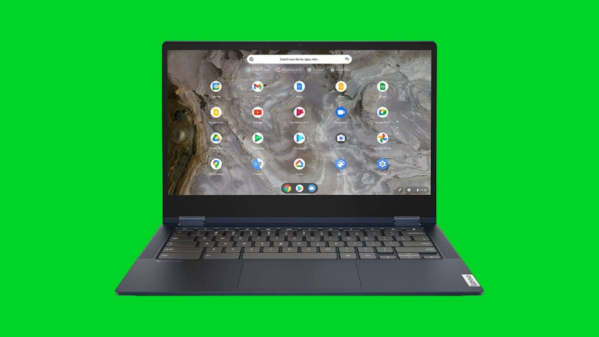A Lenovo Chromebook against a green background.