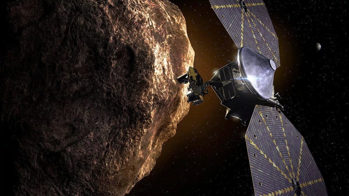 Illustration of the Lucy spacecraft and an asteroid