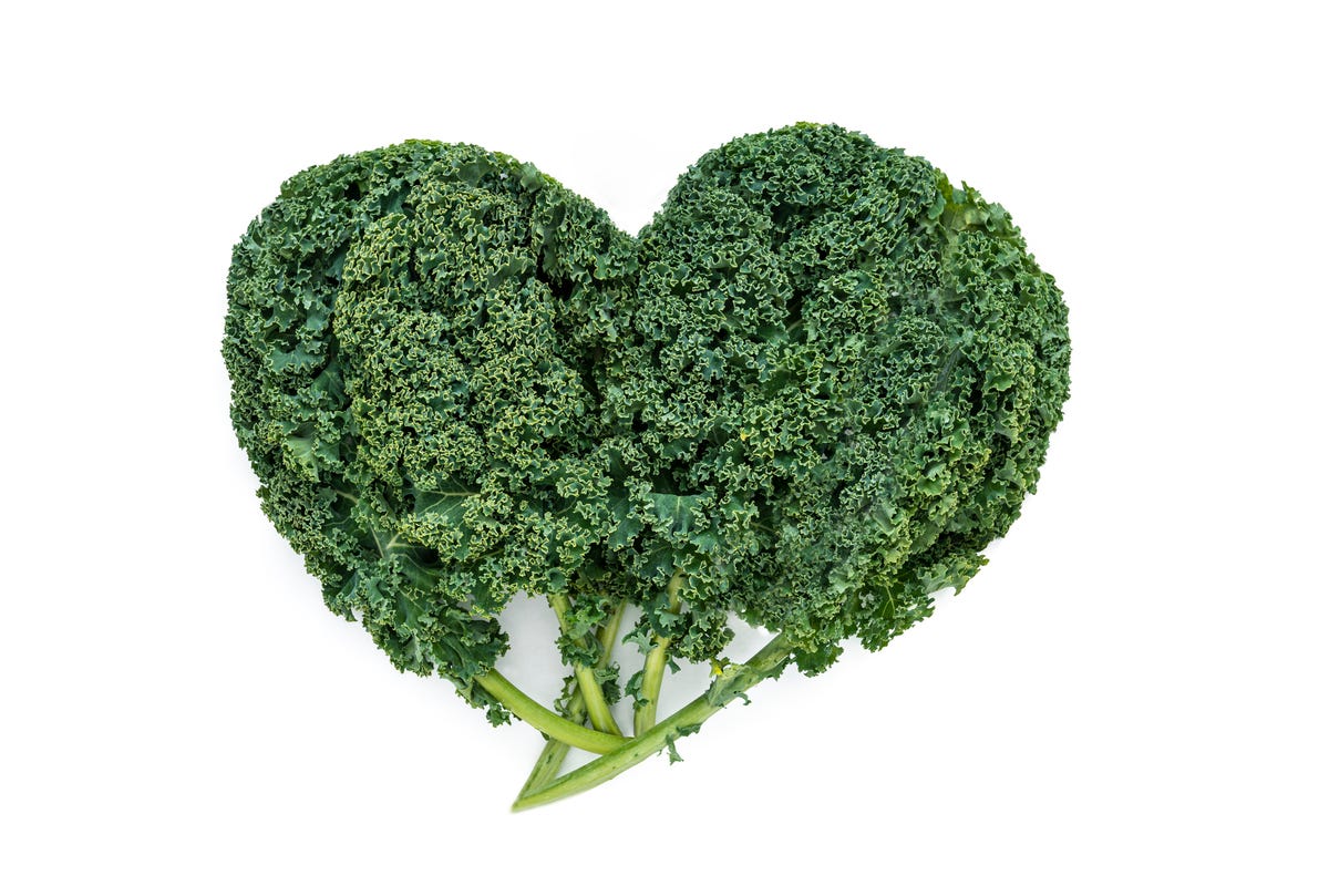 A stem of broccoli in the shape of a heart