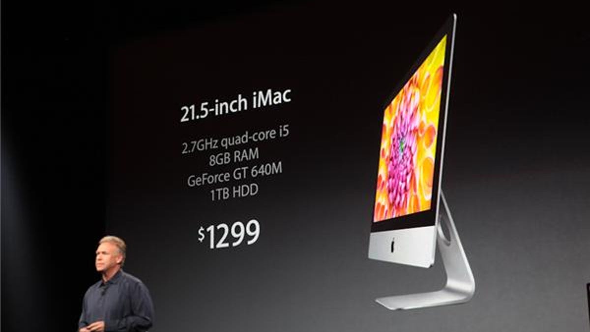 Apple executive Phil Schiller showing off the new iMac.