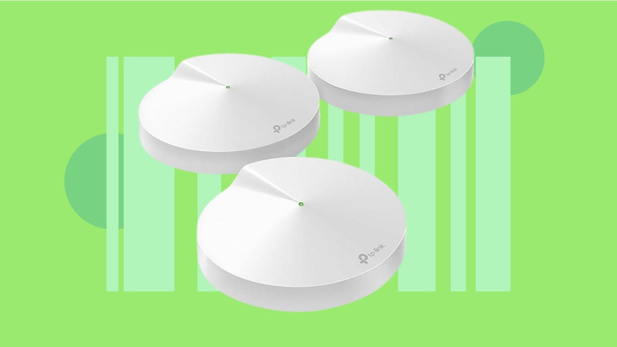 three piece wifi system against green background