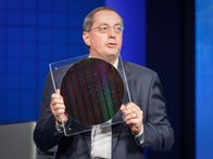 <p>Intel's then-CEO Paul Otellini speaks at Intel Developer Forum in 2009, holding a circular wafer of processors before they've been diced into individual chips.</p>