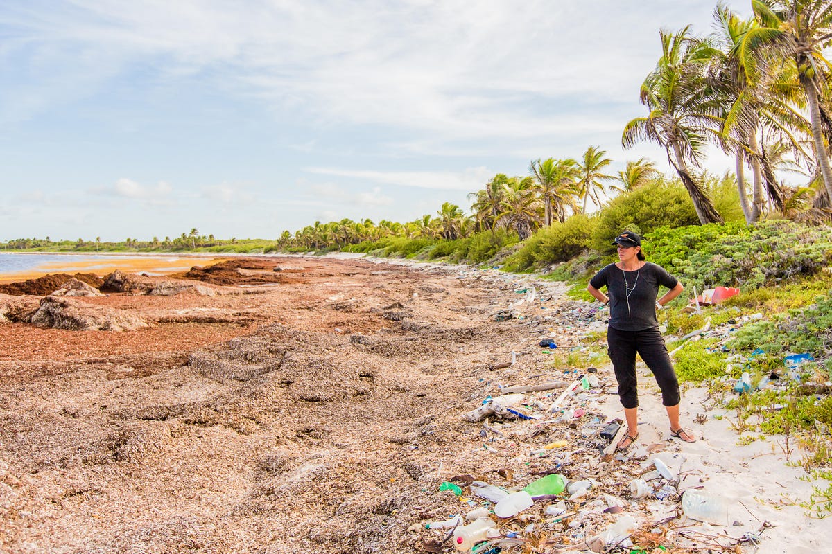Cristina Mittermeier, photographed amidst piles of coastal plastic trash
