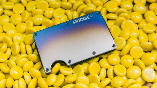 A luxury wallet by Ridge on a field of round yellow discs