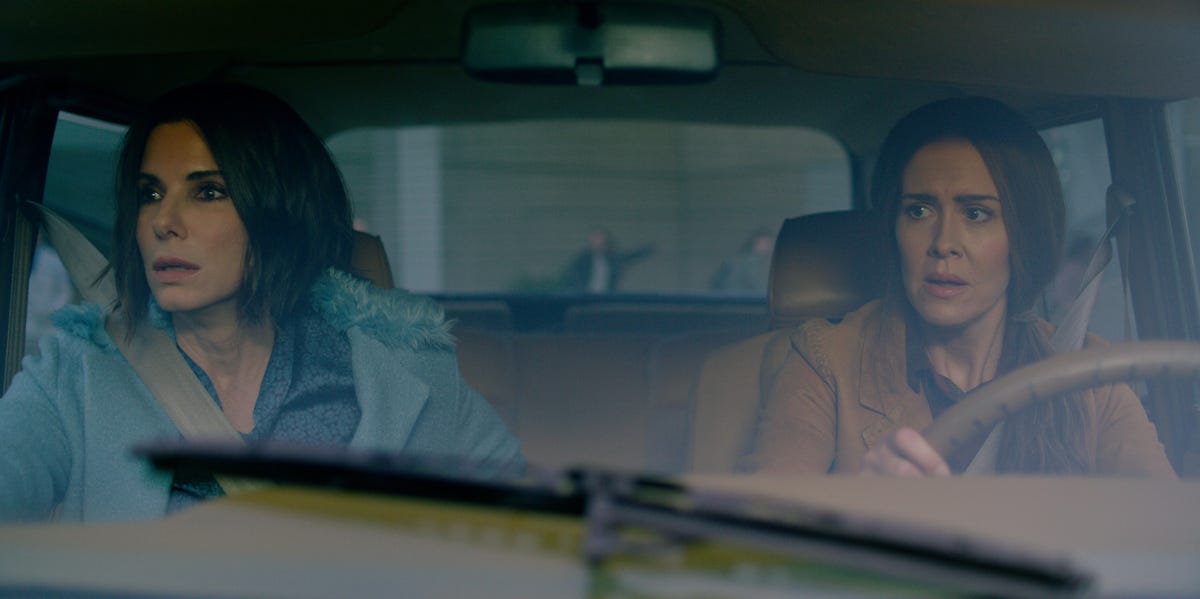 Bird Box stars Sandra Bullock and Sarah Paulson look scared as they sit in a car