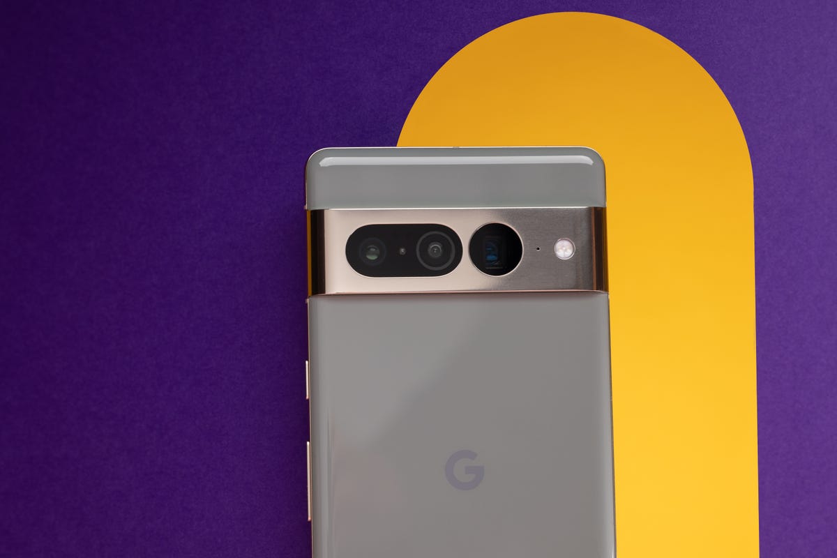 The Google Pixel Pro 7 against a yellow and purple background