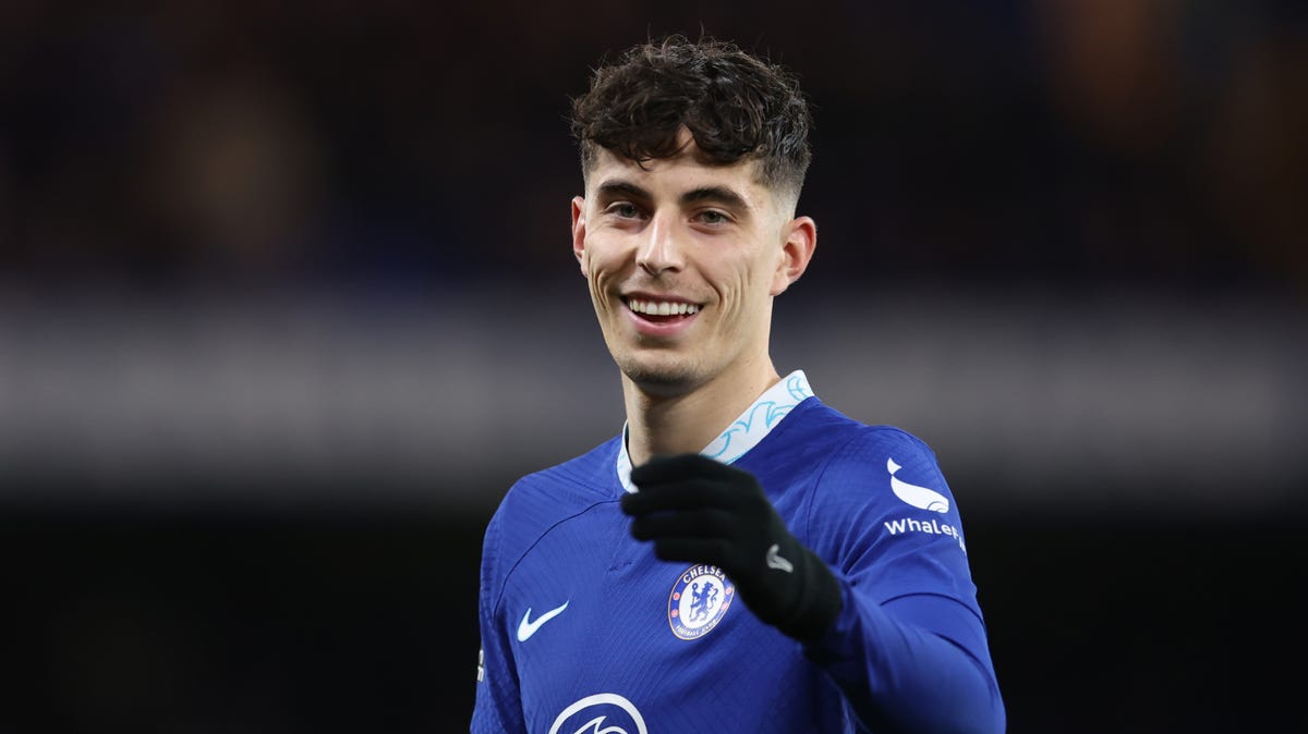 Chelsea striker Kai Havertz laughing and pointing towards the camera.