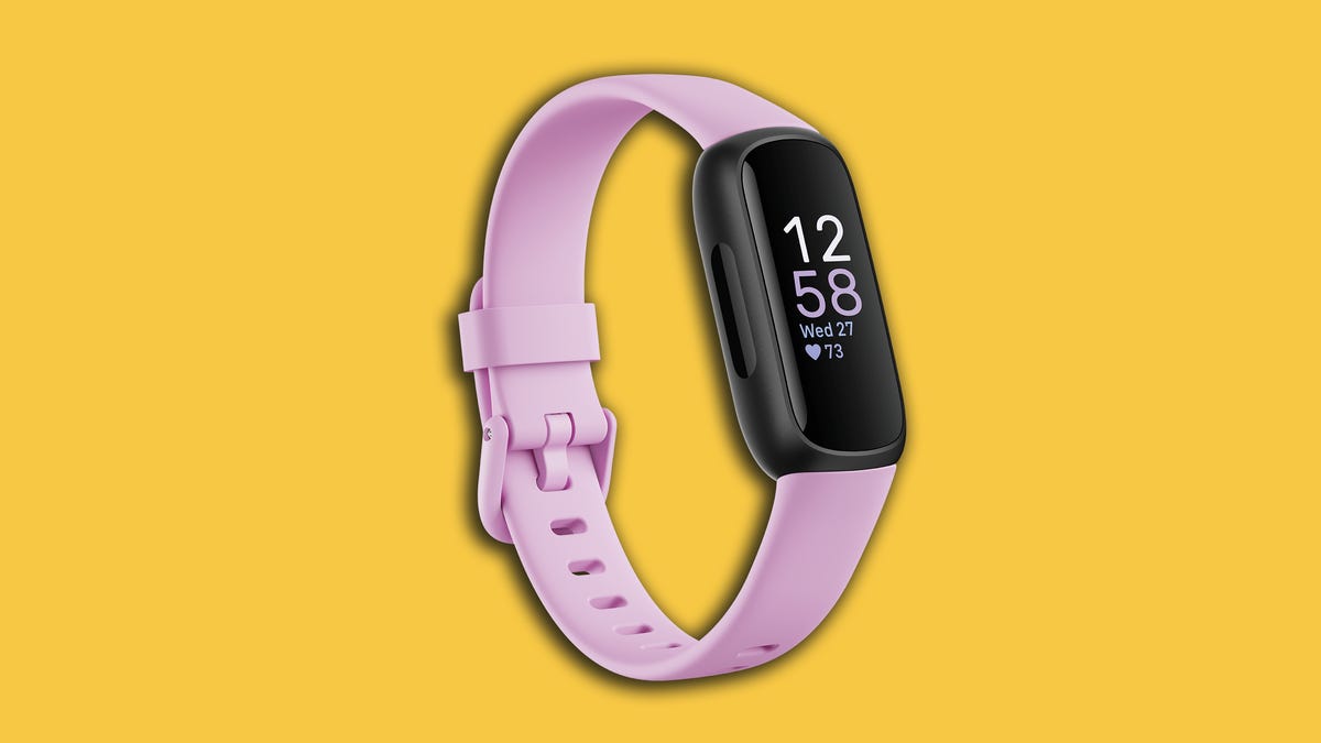 Fitbit's Inspire 3 fitness tracker with a pink band shown against a yellow background
