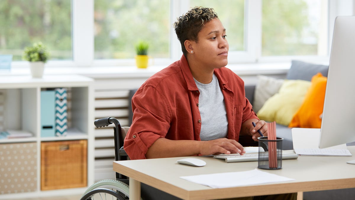 Woman in wheelchair at computer