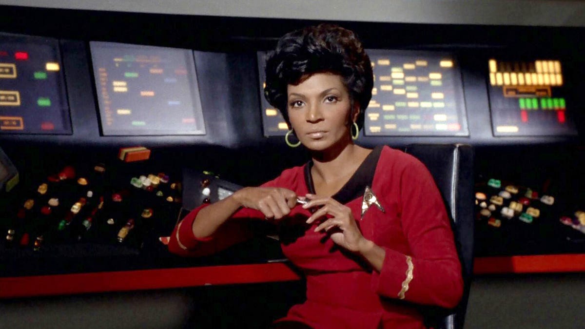 Nichelle Nichols as Lt. Uhura of the USS Enterprise at her communications console