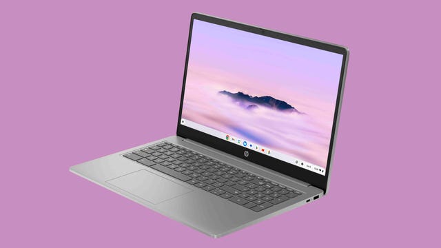 HP Chromebook Plus 15.6-inch open and front facing to the left on a lavender background.