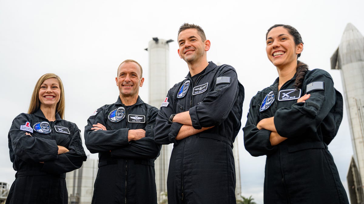 The crew of Polaris Dawn pose with a SpaceX Starship prototype. From left: Anna Menon, Scott Poteet, Jared Isaacman, Sarah Gillis.