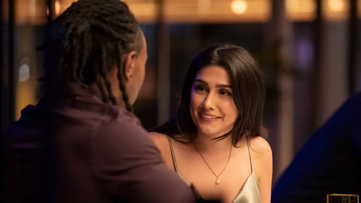 A couple sits at a bar on Netflix reality show, Dating Around.
