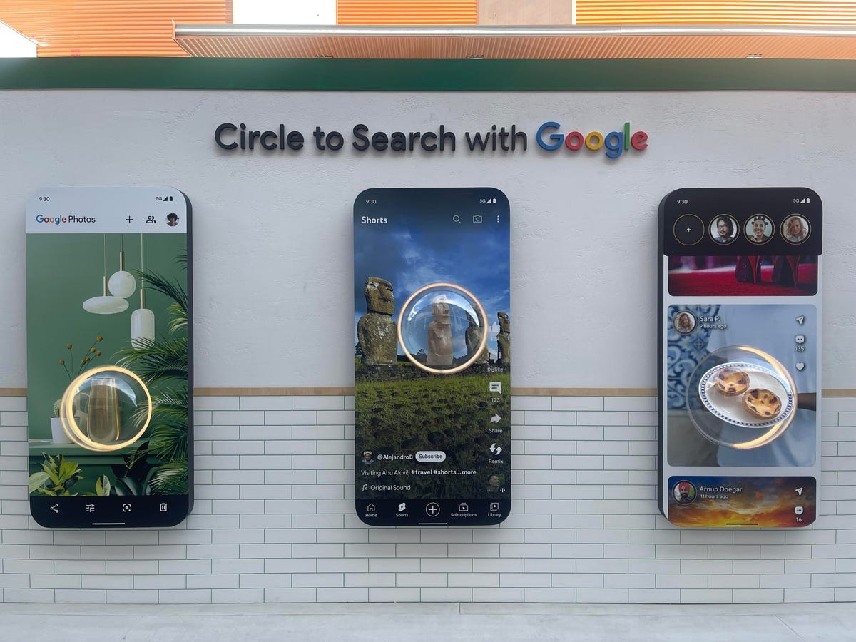 Círculo gigante para buscar demostración en tres grandes pantallas de teléfonos
