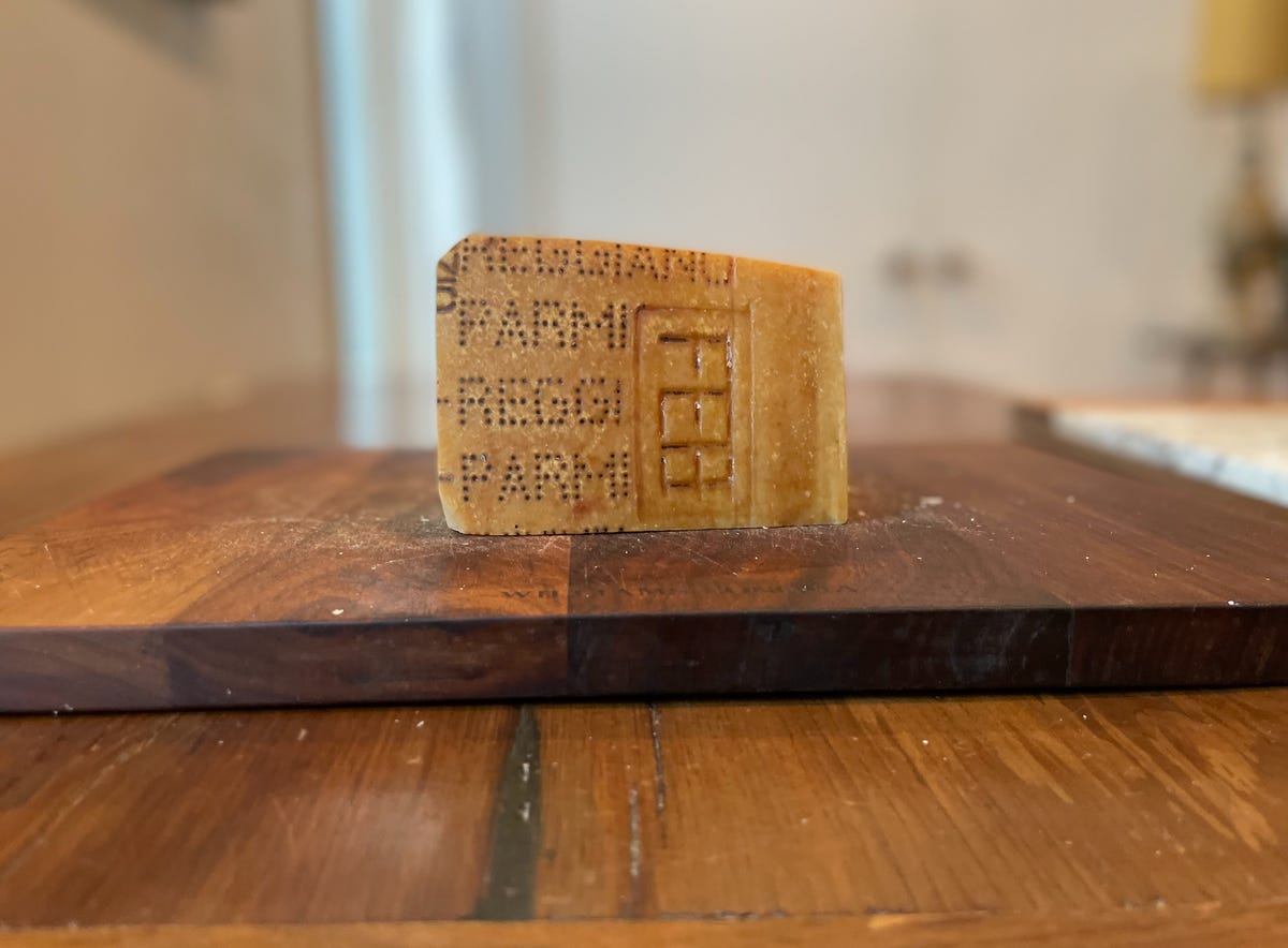 rind of Parmigiano Reggiano cheese on cutting board