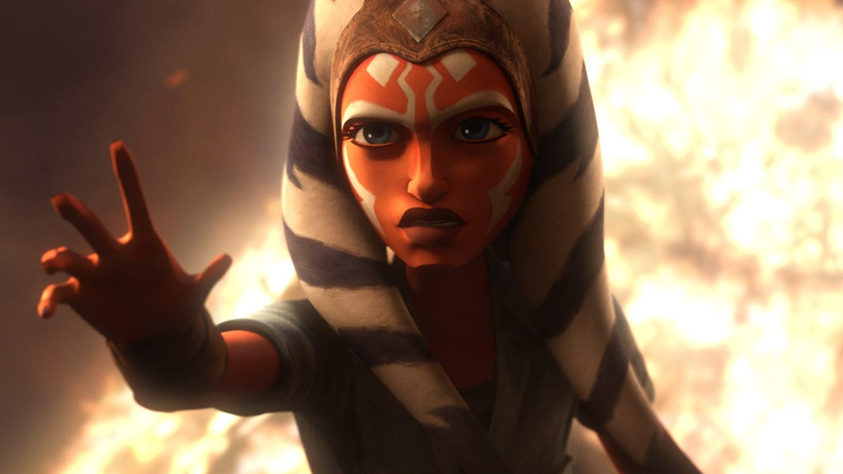 Ahsoka Tano reaches out as a fire burns behind her in Star Wars: Tales of the Jedi