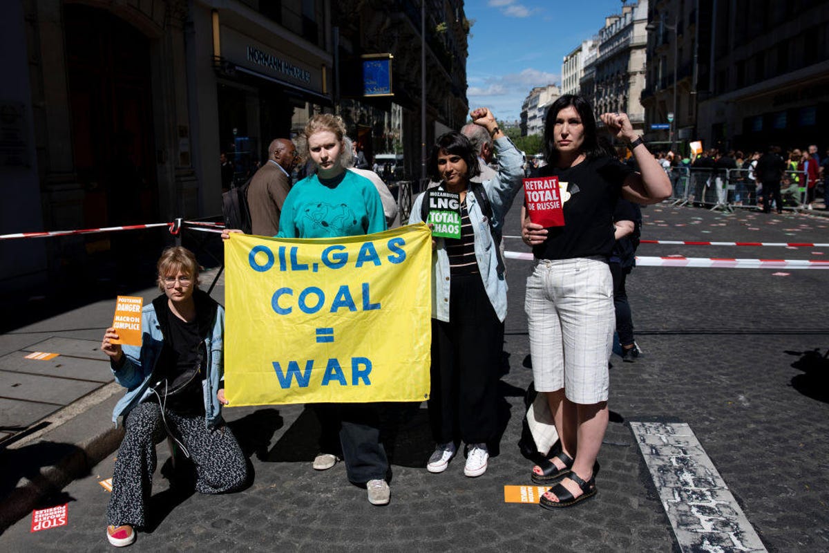 Climate activists protest outside the TotalEnergies SE annual general meeting in Paris