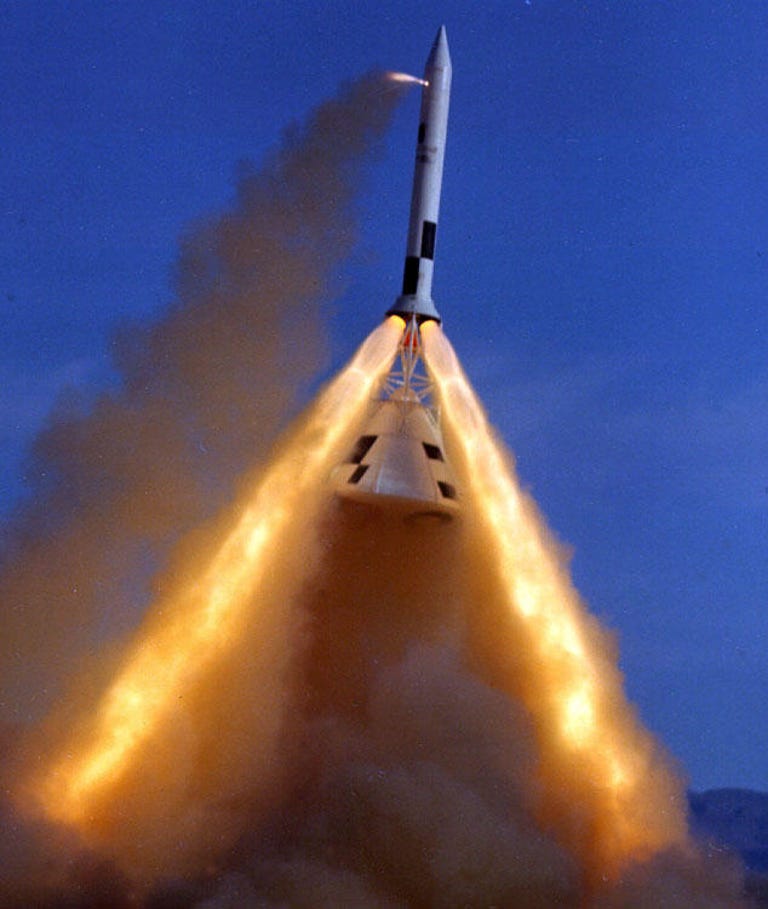 A test of the Apollo Launch Escape System in June 1965 shows the escape tower rocket firing and lifting the capsule.