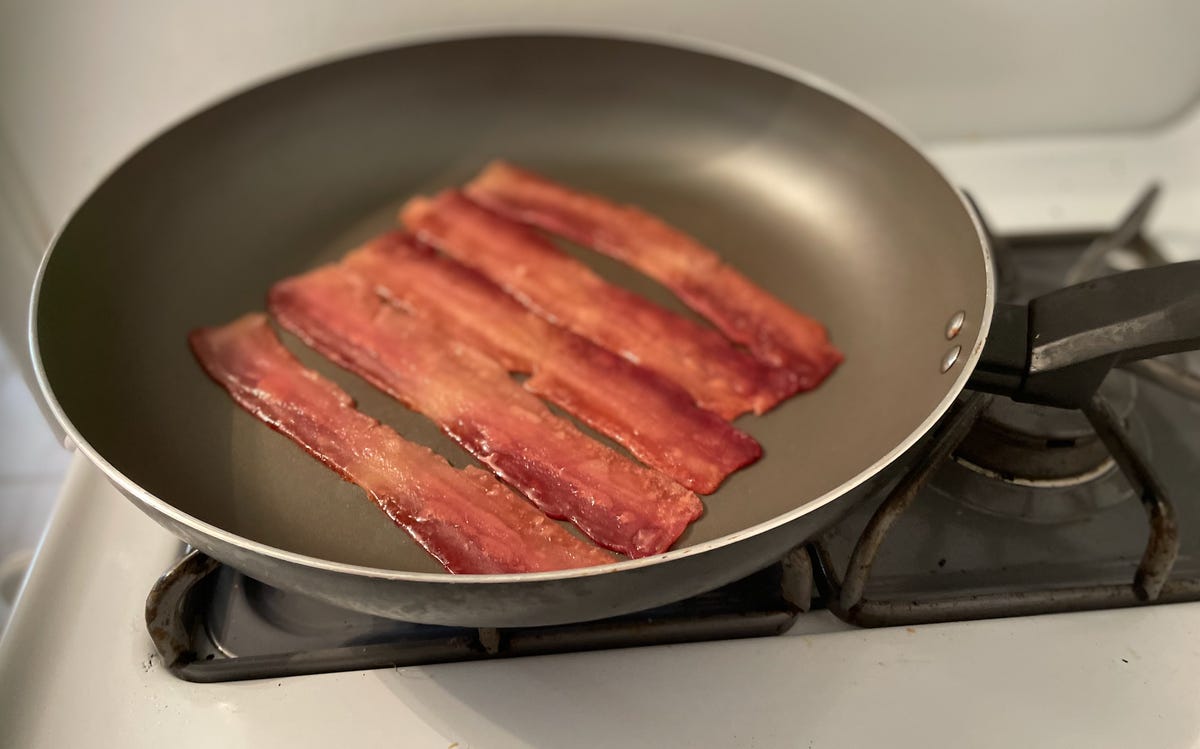 vegan bacon cooking in pan
