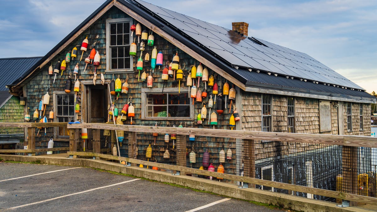 A building with solar panels decorated with buoys.