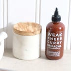 bottle of curry sriracha on counter