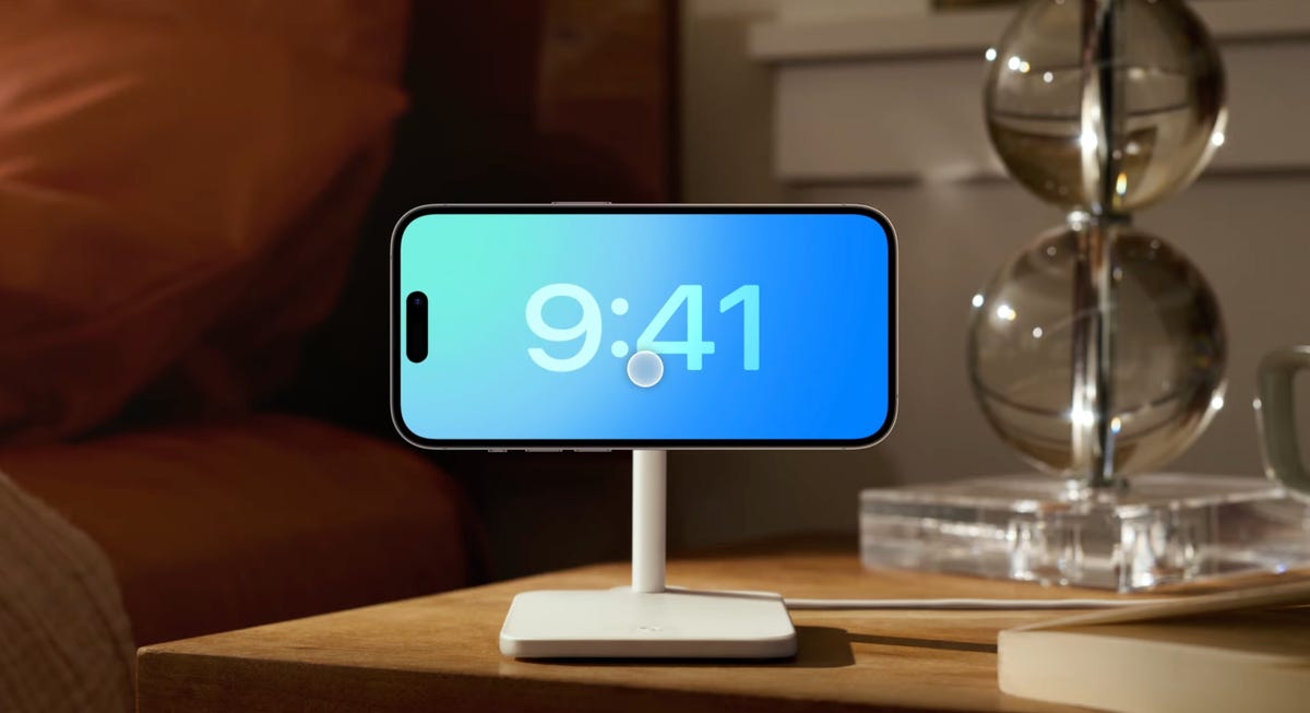 iphone on a stand with clock display
