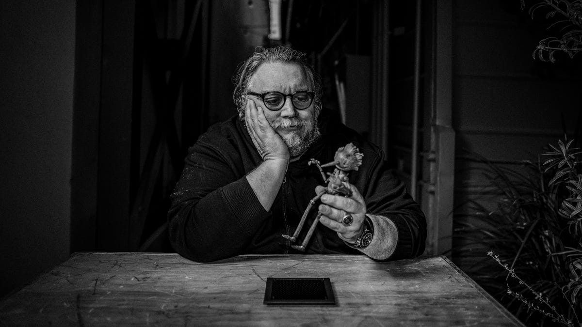 Guillermo del Toro holding Pinocchio puppet