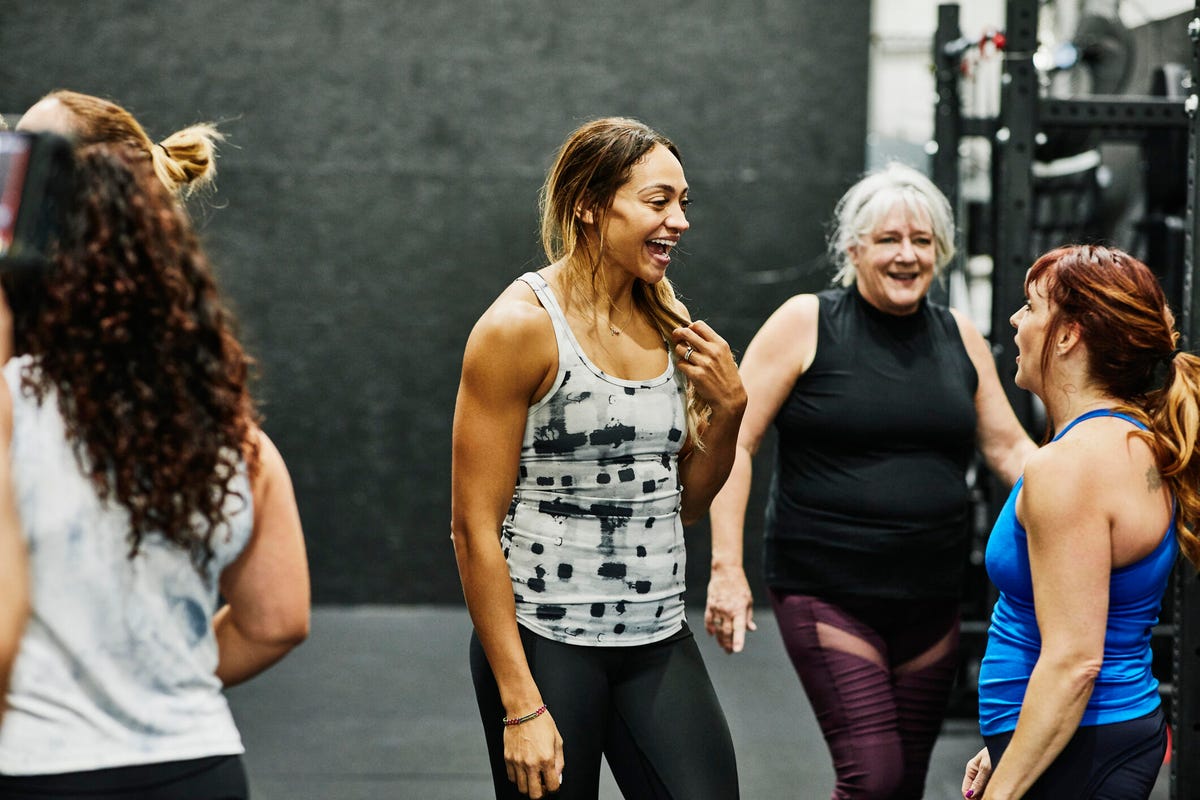 women chatting together at a fitness class
