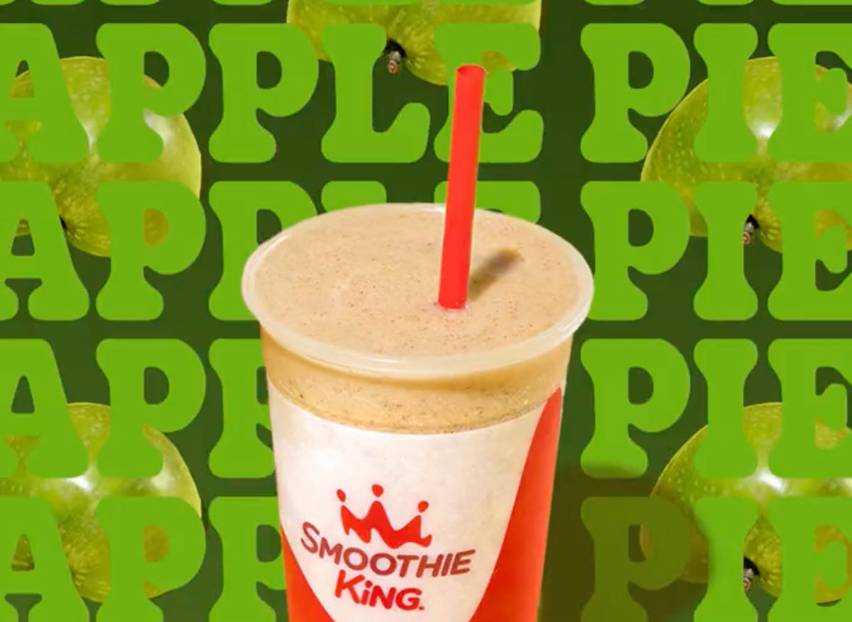 a smoothie against a green background