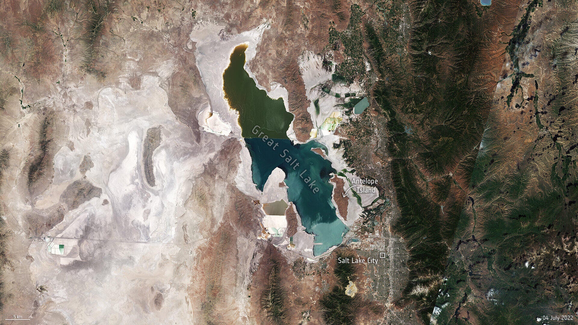 Satellite image shows Utah's Great Salt Lake greatly diminished in 2022, with white areas showing where water levels have dropped