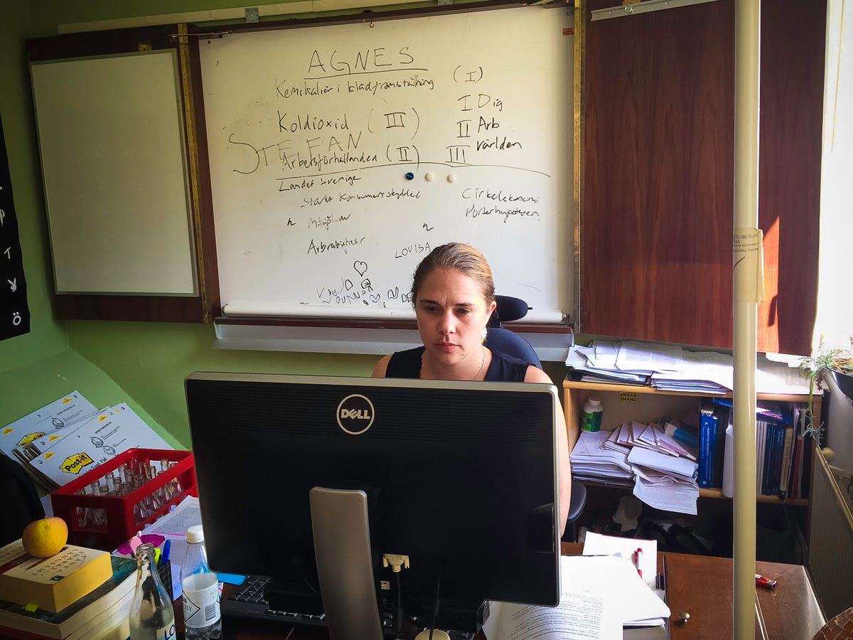 Maria Booth at her computer. A Ph.D. student in management and organization, Booth has been dismayed to see her friends and acquaintances say negative things online about asylum seekers.