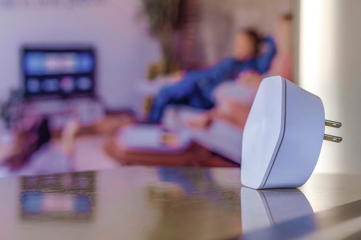 xFi Wi-Fi extender pod sitting on top of a table