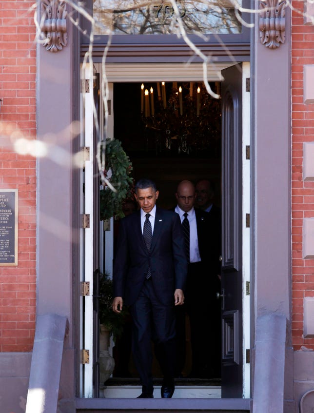 President Barack Obama leaving a National Security Agency Christmas party held across the street from the White House at the Blair House last December.