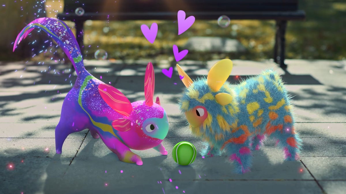 Two furry alien creatures playing in a park, with hearts popping up around them