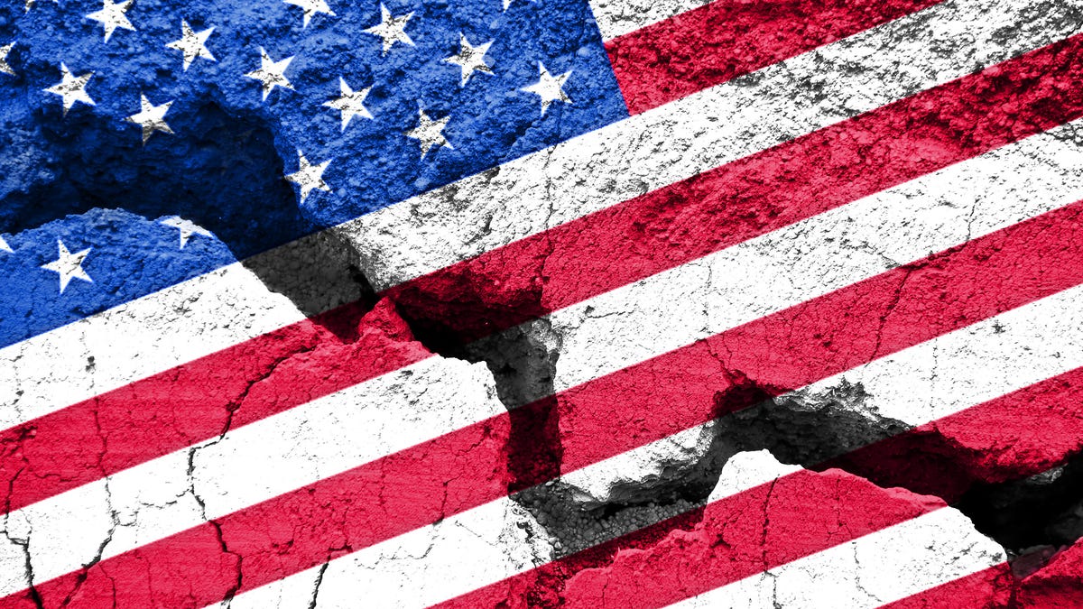 An American flag has a big crack in it, alluding perhaps to a growing rift between political parties.